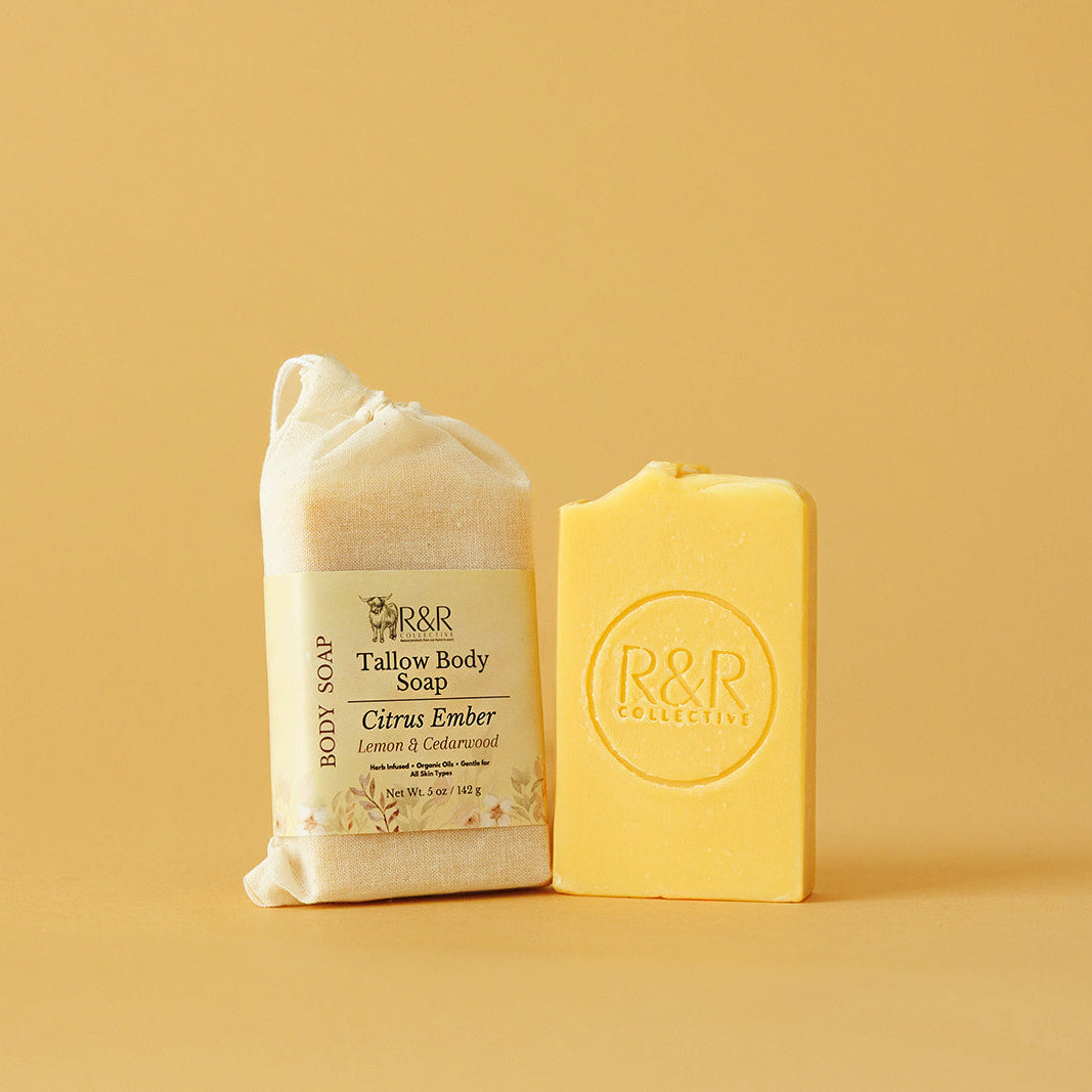 Two bars of soap, one wrapped and one unwrapped, on a beige background