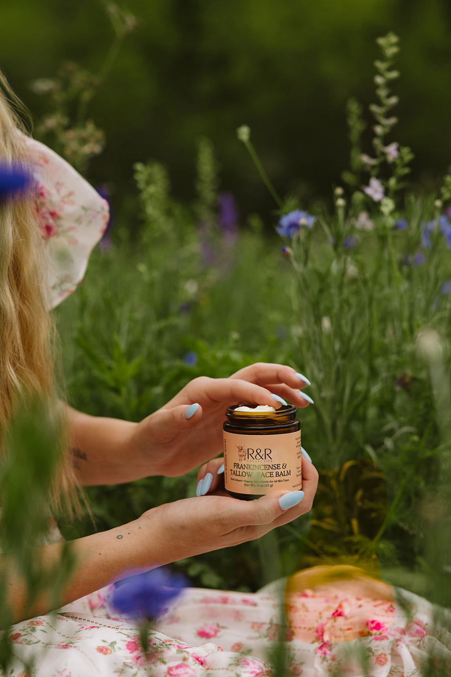 Hands holding a jar of Frankincense & Tallow Face Balm